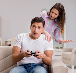 Young family suffering from computer games addiction