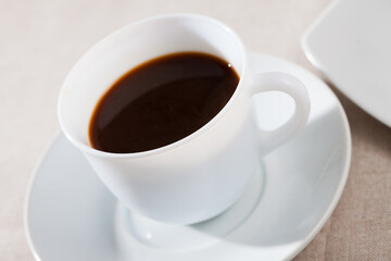 Fototapeta na wymiar Picture of cup of fresh black coffee americano on table, no people