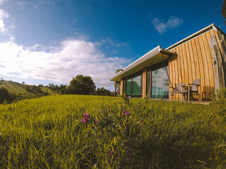 Modern style house in the ranch, North Maleny, Queensland, Australia. barn and farmhouse in a pasture in the morning