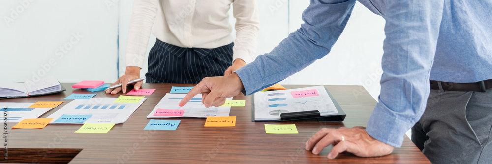 Poster businessman stick colorful notes to brainstorming on the table working on new project to share idea 