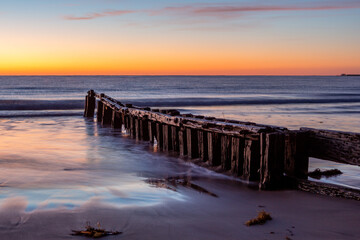 The iconic erosion groynes at sunrise in Victor Harbor South Australia on October 20 2020