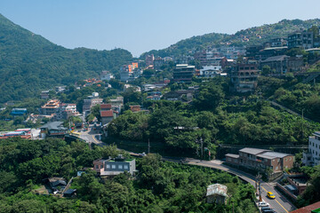 Fototapeta na wymiar landscape view of JiuFen Village with mountain residental buildings and blue sky.