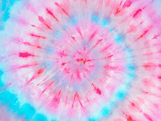 Colorful red cyan spiral tie dye background pattern. Swirl hippie tiedye wallpaper. Boho festive tie-dye backdrop.