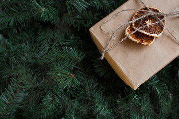 christmas background of fir branches and gift box
