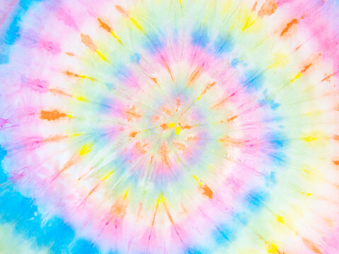 Rainbow tie-dye wallpaper. Hippie spiral tie bye background. Colorful burst. 