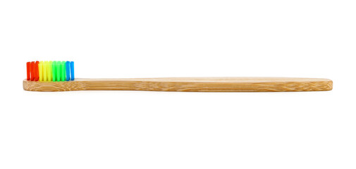 A colorful bamboo toothbrush on a white background