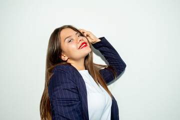 Fototapeta premium Happy business woman. Carefree lifestyle. Individuality confidence. Portrait of cheerful lady posing looking at camera smiling isolated on light neutral empty space background.
