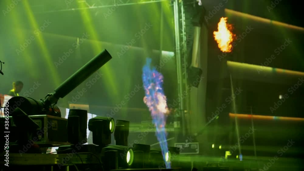 Aufkleber fireworks exploding on edge of stage at live festival at night - party pyrotechnics in slow motion -