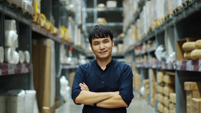 male manager with arms crossed in the warehouse store