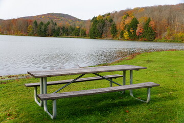 A picnic table overlooking the fall foliage near Mount Pisgah State Park, Troy, Pennsylvania, U.S