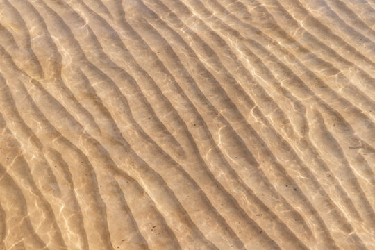 Sandy seabed pattern under shallow water