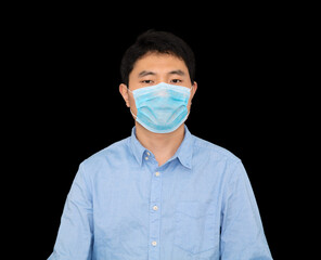Man wearing mask standing in front of black background