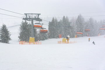 Ski slope at Slotwiny Arena ski station at snowstorm