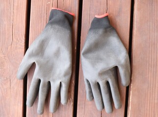 gardening gloves on wooden background