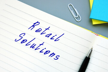 Financial concept meaning Retail Solutions with inscription on the piece of paper.