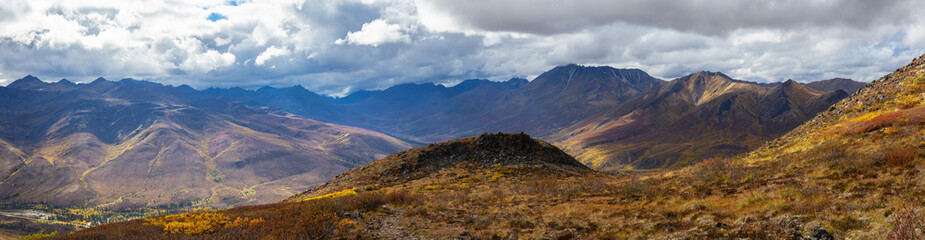 Panoramic View of Scenic Mountains and Valley from Above on A Beautiful Fall Day in Canadian Nature. Aerial Shot. Taken in Tombstone Territorial Park, Yukon, Canada.