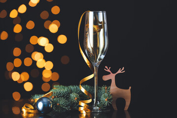 Christmas composition on table against blurred lights