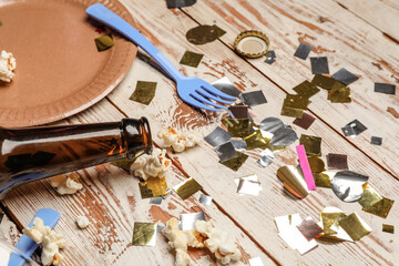 Mess after party celebration on wooden background