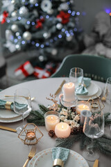 Beautiful table setting with Christmas decor in living room