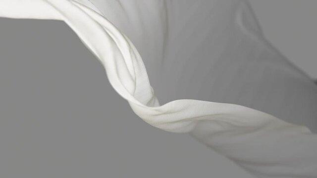 4k White wave satin fabric loop background.Wavy silk cloth fluttering in the wind.tenderness and airiness.3D digital animation of seamless flag waving ribbon streamer riband.