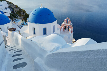 Whitewashed village, blue domes in Oia, Santorini Greece. mediterranean sea.