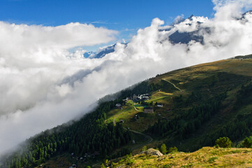 Obraz na płótnie Canvas Beautiful Swiss Alps landscape with mountain in clouds view in summer, Zermatt, Switzerland 