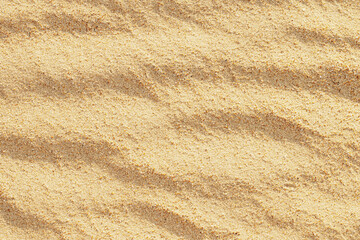 Fototapeta na wymiar The texture of white, light, beige sand close-up. View from above. The photo.