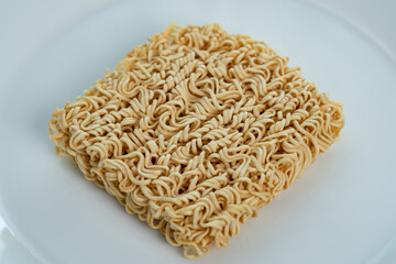 Instant noodle on white plate background.