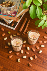 Indian masala tea or chai. Milk tea Badam pista chai or dry fruit tea of Amritsar, Punjab India. hot herbal spiced, aromatic spices organic ayurvedic drink, Kerala good in winter for immunity boosting