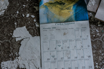 old calendar with carlos santana on the floor from a house