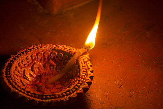 Diya or oil lamps lit during Diwali festival.Happy Diwali