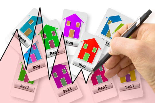 Hand drawing a graph about real estate market trends - concept image