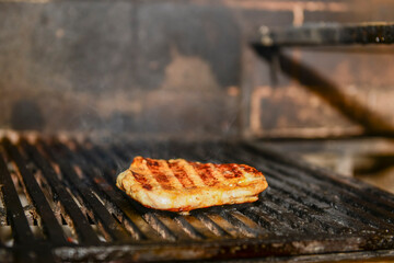 Assorted meat from pork and mushrooms vegetables on barbecue grill cooked for summer family dinner