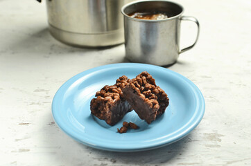 Chocolate bar on a plate with coffee