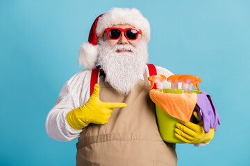 Close-up portrait of his he nice attractive glad cheerful Santa cleansing doing domestic housework...
