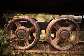 Metal wheels of an abandoned wagon