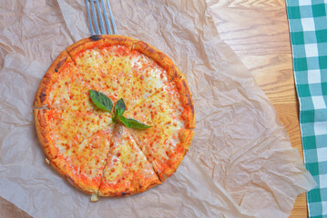 Pizza margherita. Traditional Italian cuisine, Italian pizza margarita. Taking a piece of pizza. Delicious meal concept.