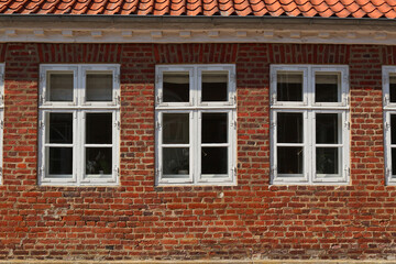 White wooden windows in red brick stone house (Jutland, Denmark)