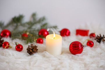 Fototapeta na wymiar red candle and christmas balls