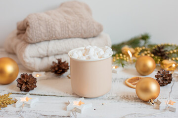 Christmas background , coffee mug and marshmallows , Golden Christmas tree toys .  Merry Christmas greeting card