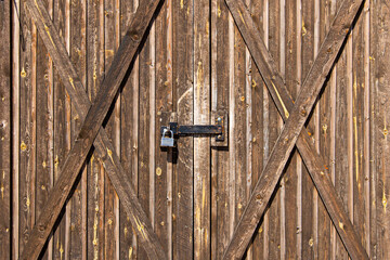 locked wooden plank barn gates