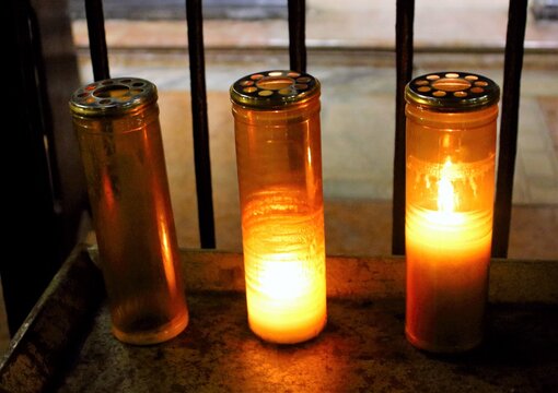 striking image of a group of votive candles in a church