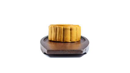 Mooncake, mid autumn festival cake on the wooden dish isolated on white background.