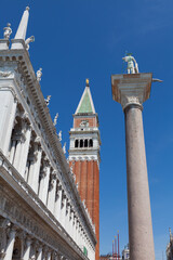 Fototapeta na wymiar Close view of St Mark's Campanile and Palazzo Ducale at Piazzetta San Marco in Venice, Italy.