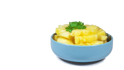 pineapple sliced serve on the blue bowl, closeup photoshoot & isolated on the white background.