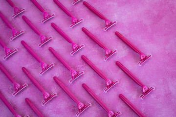 Many pink razor blades on the table