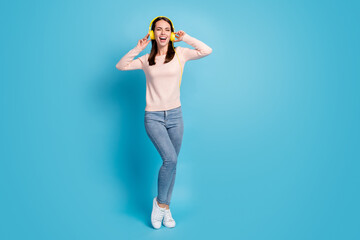 Full length body size view of her she nice attractive pretty cheerful cheery glad girl listening hit bass stereo sound having fun isolated over bright vivid shine vibrant blue color background