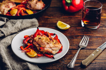 Baked chicken thighs with red bell peppers and lemon