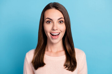 Fototapeta premium Portrait of astonished girl shout loudly wear winter pullover isolated over blue pastel color background