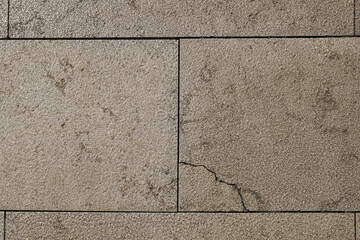 light brown and gray slabs with cracks
